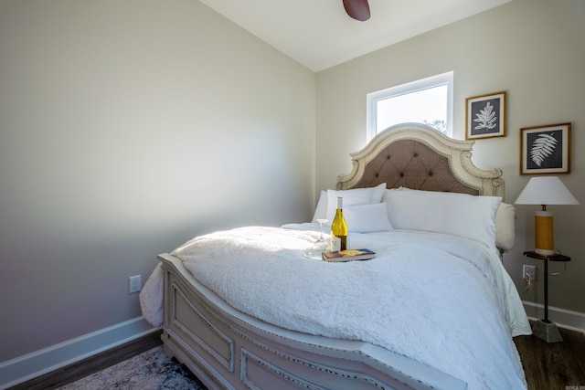 bedroom featuring ceiling fan, lofted ceiling, and dark wood-type flooring