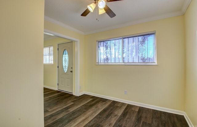 entryway with ornamental molding, ceiling fan, and dark wood-type flooring