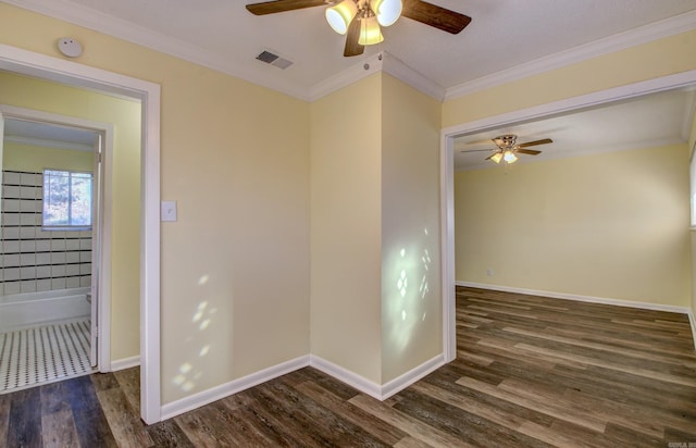 unfurnished room with ceiling fan, dark hardwood / wood-style flooring, and crown molding