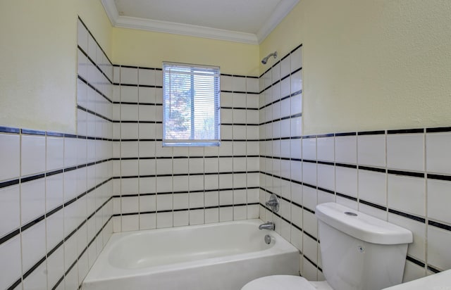 bathroom with  shower combination, toilet, tile walls, and crown molding