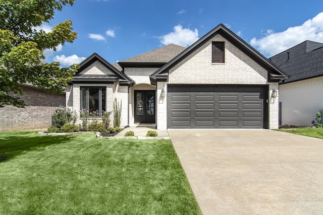 view of front of home featuring a front lawn and a garage