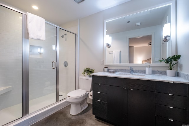 bathroom featuring vanity, toilet, a shower with door, and concrete floors