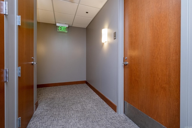 corridor featuring a paneled ceiling