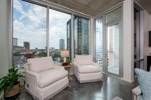 sitting room with plenty of natural light and a wall of windows