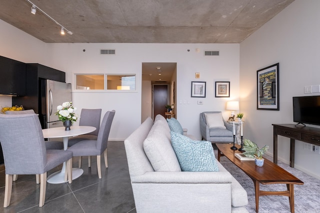 living room featuring rail lighting