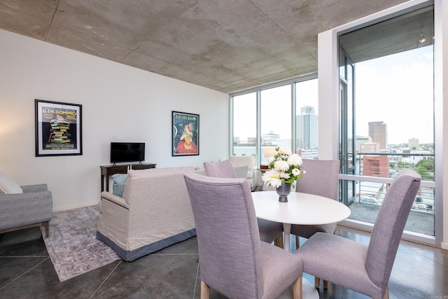 dining space featuring floor to ceiling windows