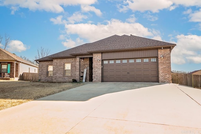 view of front of house with a garage and a front yard