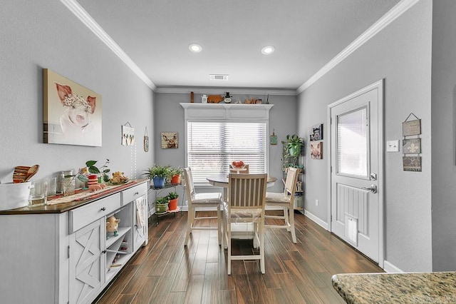 dining area with crown molding