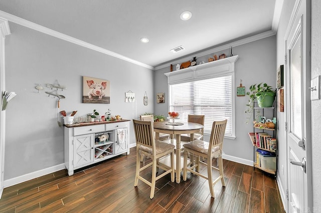 dining space featuring ornamental molding