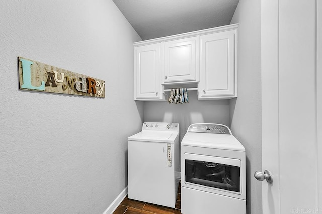 washroom with cabinets and independent washer and dryer