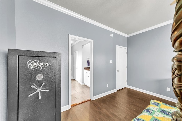 interior space with hardwood / wood-style floors and ornamental molding