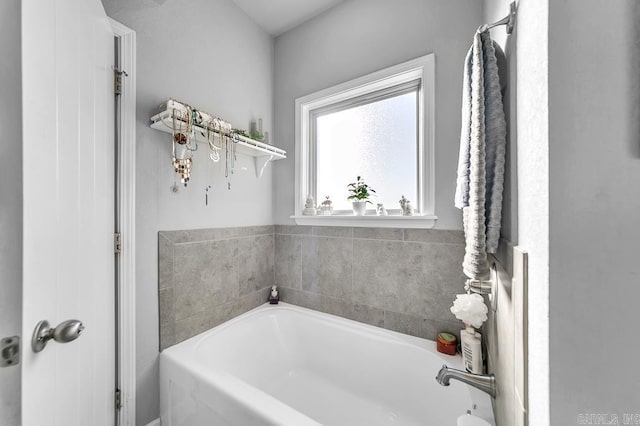 bathroom with a tub