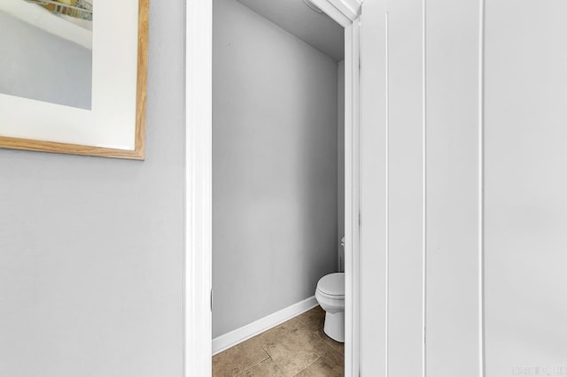 bathroom featuring tile patterned flooring and toilet