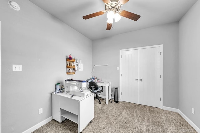 carpeted office with ceiling fan