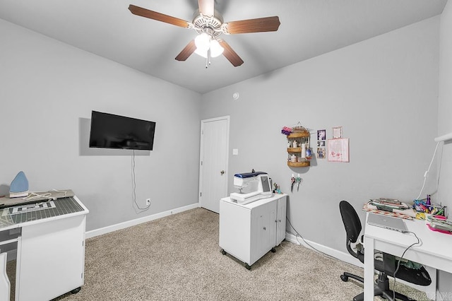 office with light carpet and ceiling fan