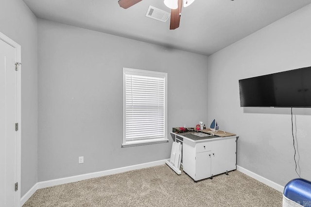 interior space with ceiling fan, light carpet, and a wealth of natural light