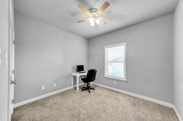 office space featuring carpet and ceiling fan