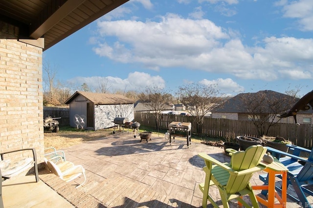 view of patio / terrace with a shed