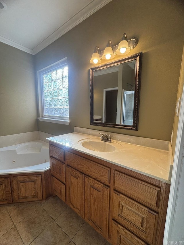 bathroom with vanity, tile patterned floors, a bathtub, and ornamental molding