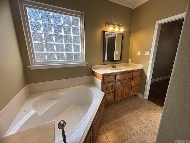 bathroom featuring a wealth of natural light, tile patterned flooring, a tub to relax in, vanity, and ornamental molding