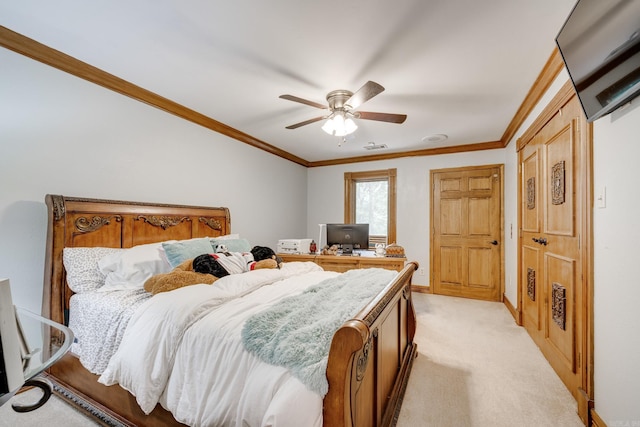 carpeted bedroom with ceiling fan and ornamental molding