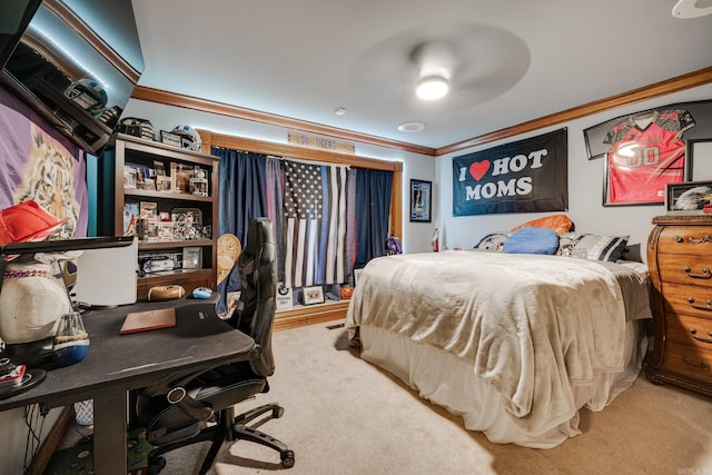 bedroom with ceiling fan, ornamental molding, and carpet floors