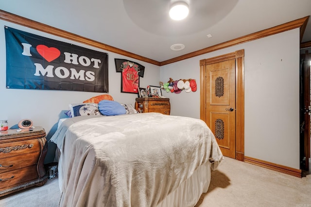 carpeted bedroom featuring ceiling fan and crown molding