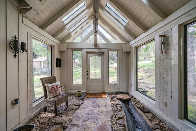 sunroom with lofted ceiling with skylight