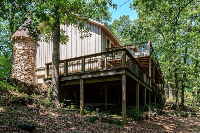 rear view of house featuring a deck