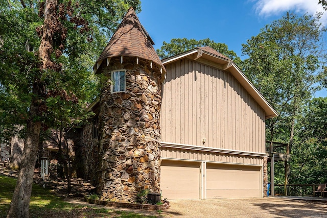 view of front of home featuring a balcony and a garage