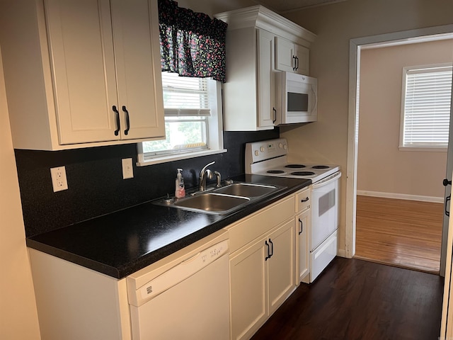 kitchen featuring white cabinets, dark hardwood / wood-style flooring, white appliances, and sink