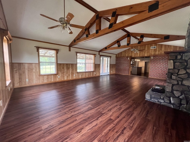 unfurnished living room featuring beam ceiling, dark hardwood / wood-style floors, high vaulted ceiling, and ceiling fan