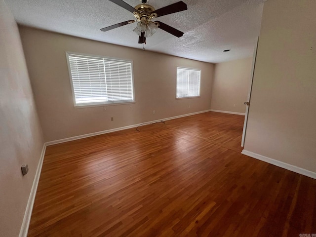 unfurnished room featuring a textured ceiling, hardwood / wood-style flooring, and ceiling fan