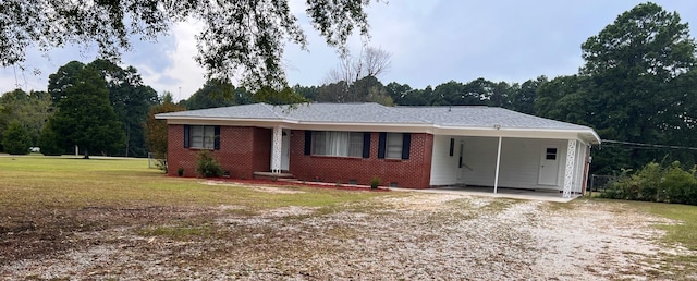 single story home featuring a front lawn and a carport