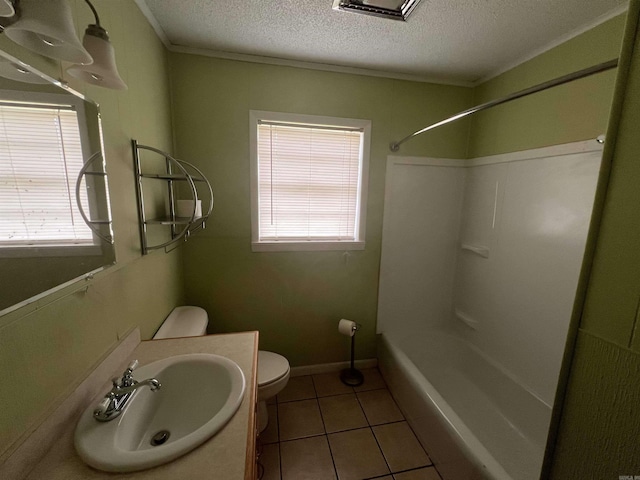 full bathroom with tile patterned flooring, toilet, a textured ceiling, and a wealth of natural light