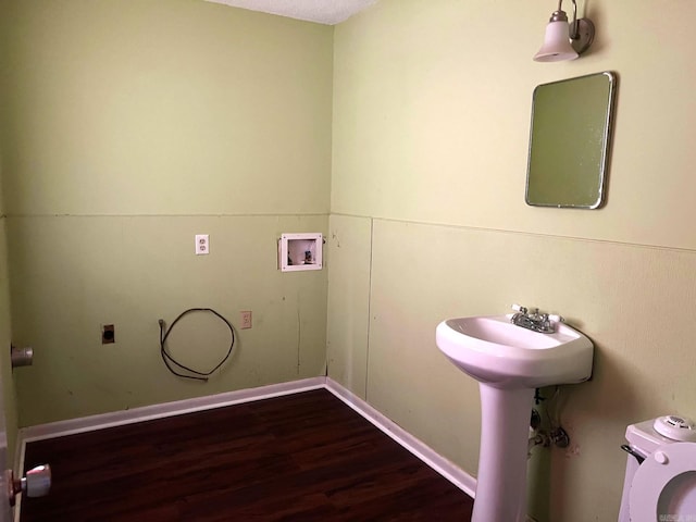 laundry room with hookup for an electric dryer, hookup for a washing machine, and dark hardwood / wood-style floors