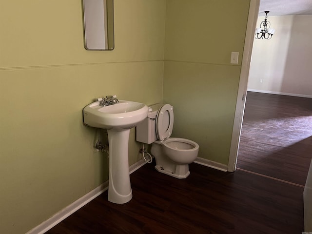 bathroom with wood-type flooring and toilet