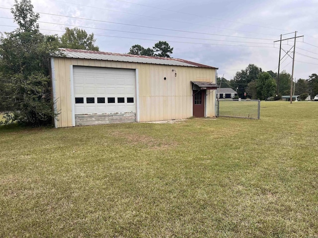 garage with a yard