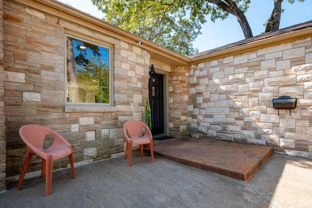 doorway to property featuring a patio area