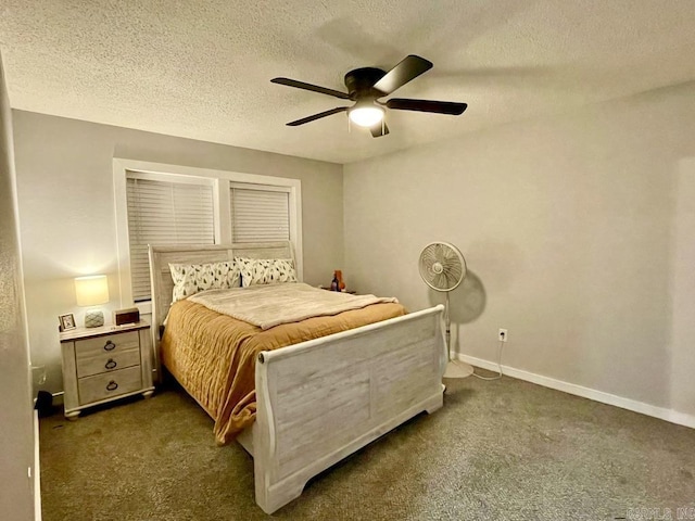 carpeted bedroom featuring ceiling fan and a textured ceiling