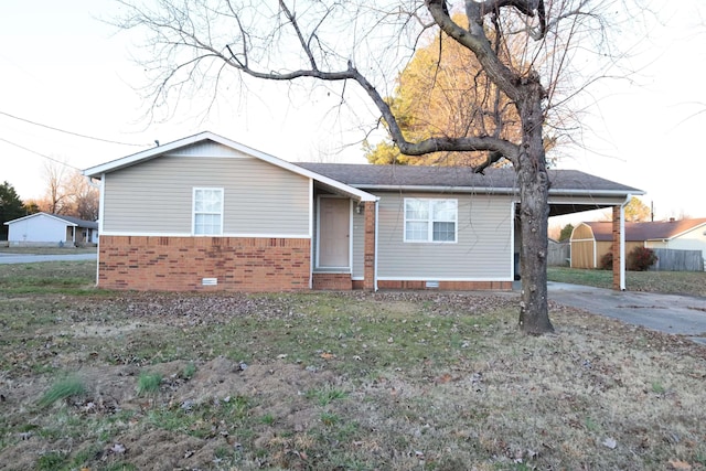 single story home featuring a carport