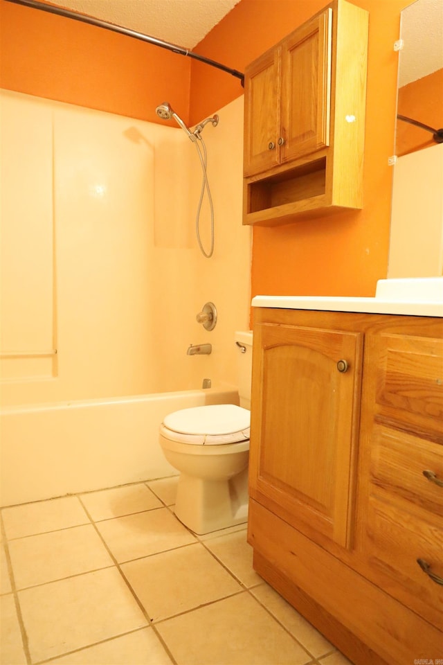 full bathroom featuring tile patterned flooring, vanity, toilet, and shower / washtub combination