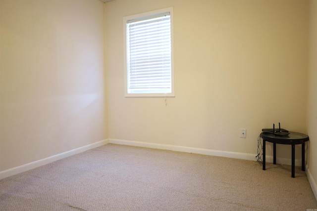 carpeted spare room with plenty of natural light