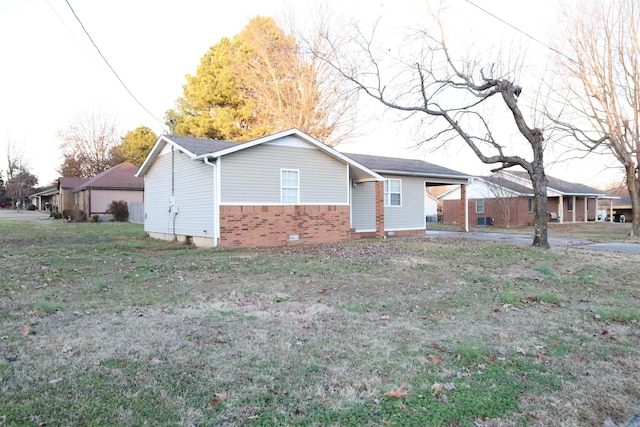 ranch-style house with a front lawn