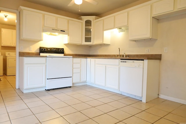 kitchen with white cabinets, dishwasher, range, and washer / clothes dryer