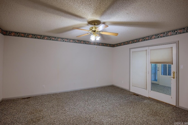 unfurnished bedroom featuring ceiling fan, carpet, and a textured ceiling