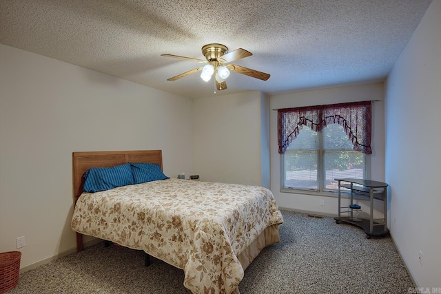 bedroom featuring carpet, a textured ceiling, and ceiling fan