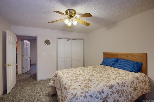 carpeted bedroom featuring ceiling fan, a textured ceiling, and a closet