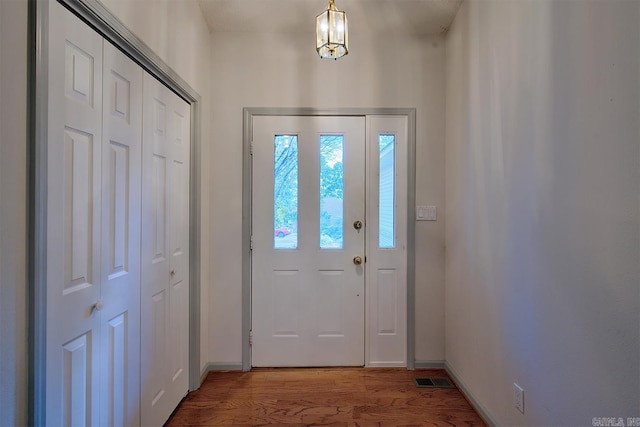 entryway with wood-type flooring