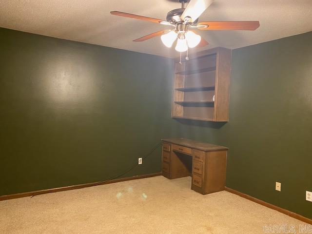 carpeted empty room with ceiling fan